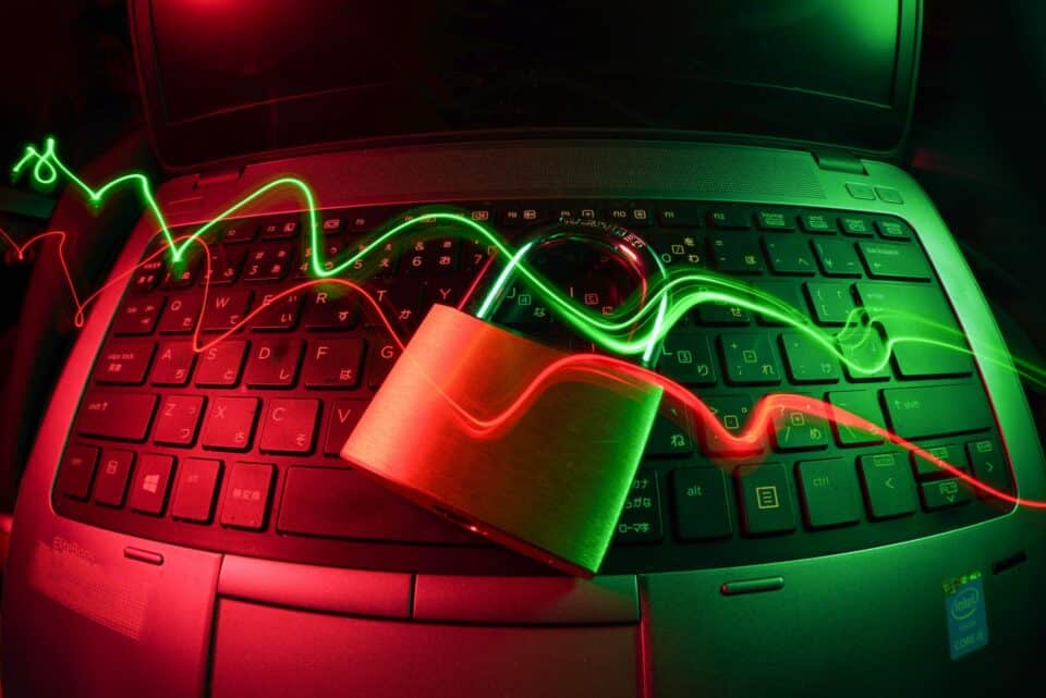 Colourful data waves moving across a dark digital technology background