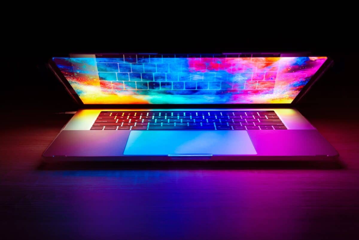 Close-up of a computer keyboard illuminated with colourful lights