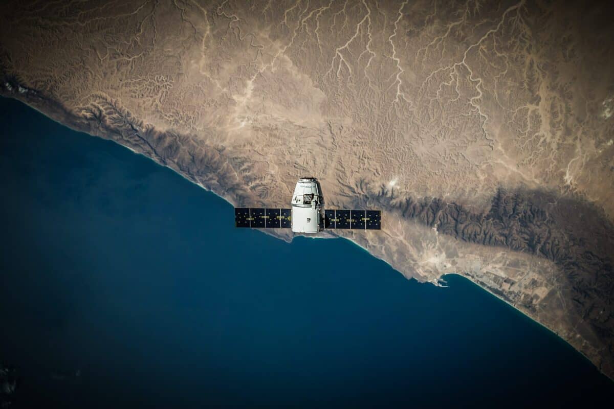 SpaceX technology viewed across a wide mountainous landscape