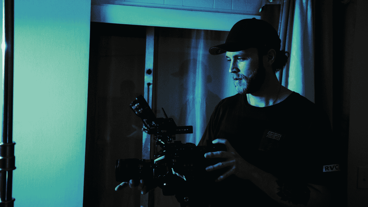 Professional working in a dark content and media production environment