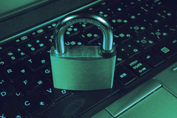 Illuminated padlock protecting data in a dark cyber security graphic