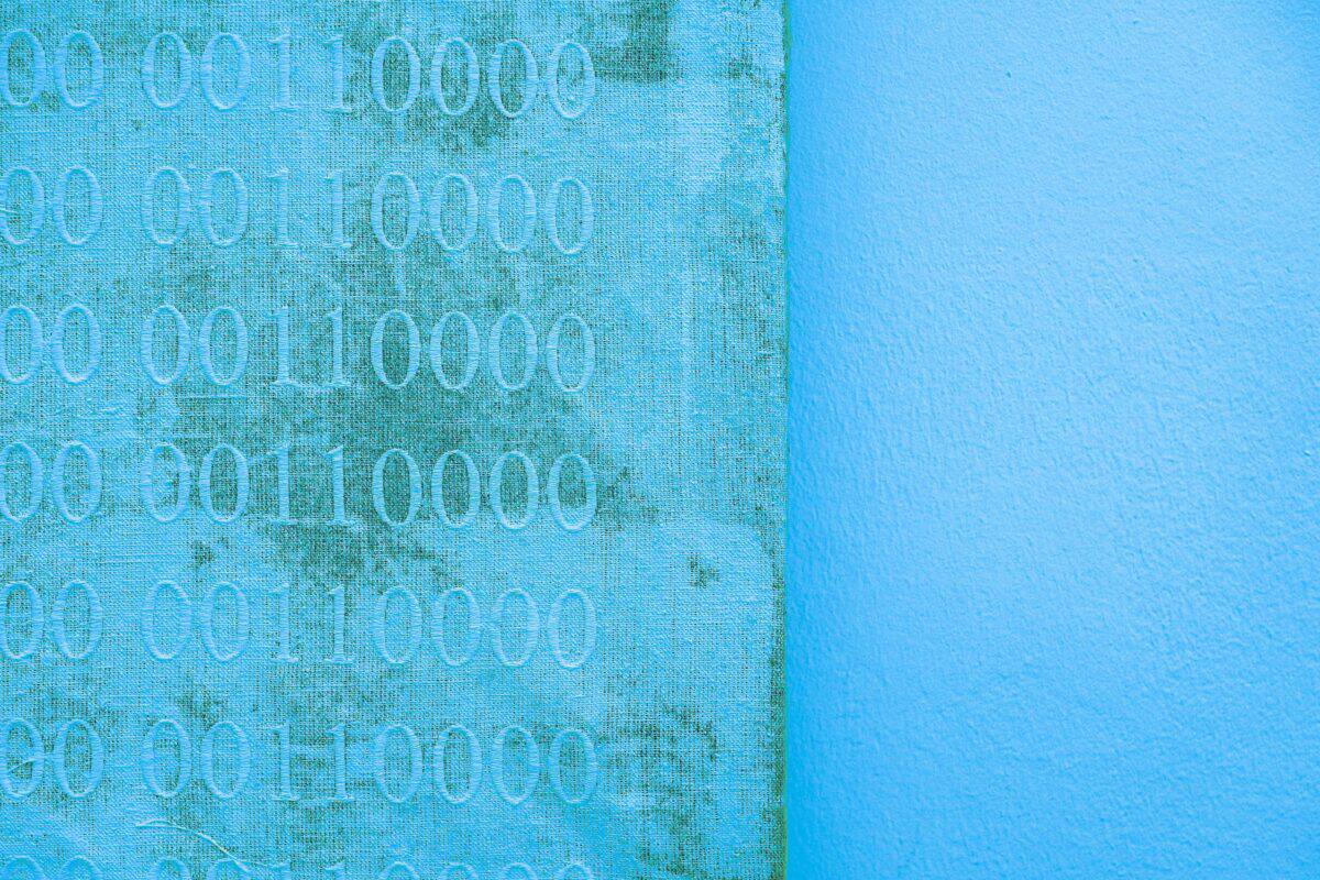 Soft blue digital background with faint code and network patterns