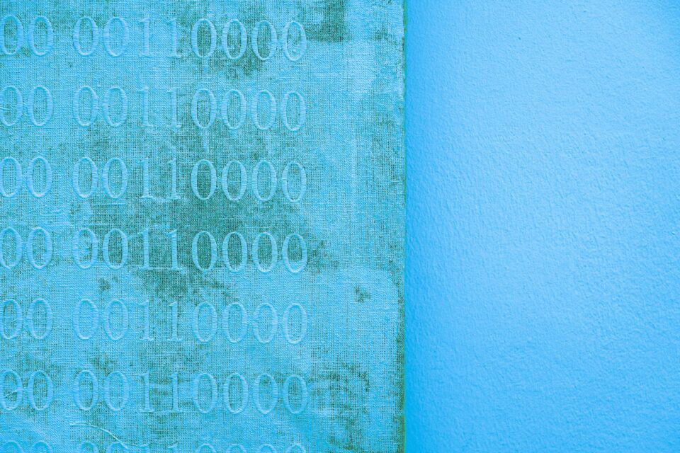 Soft blue digital background with faint code and network patterns
