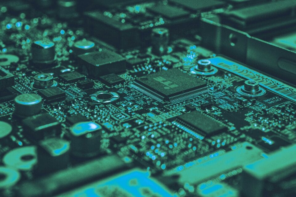 Electronic hardware components across a dark cyber security circuit board