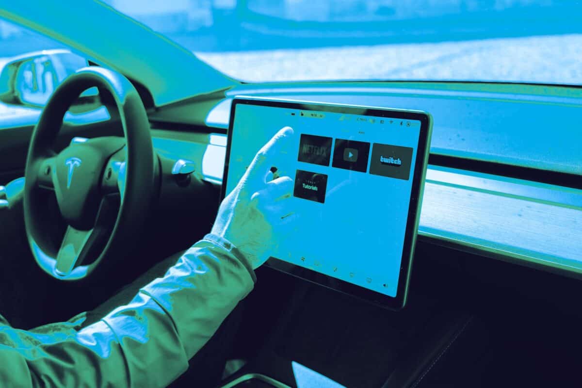 Hand using a tablet interface for connected digital media