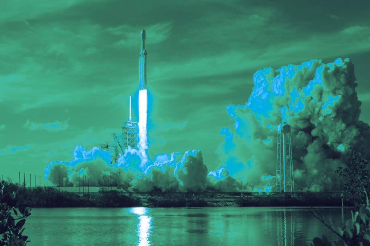 Rocket launching through clouds into the upper atmosphere