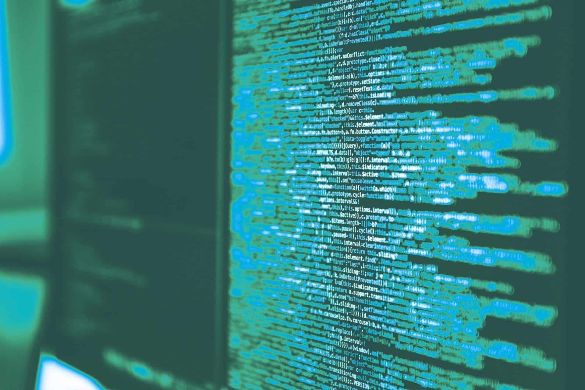 Green computer code covering a screen in a cyber security environment