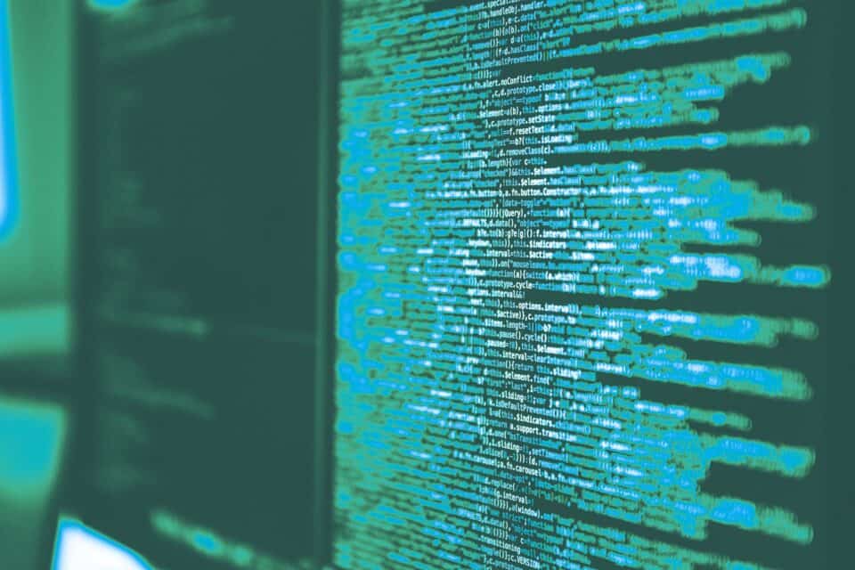 Green computer code covering a screen in a cyber security environment
