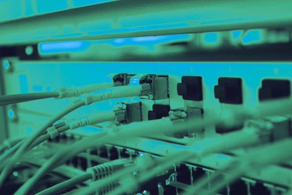 Network cables connected to a router for digital communications
