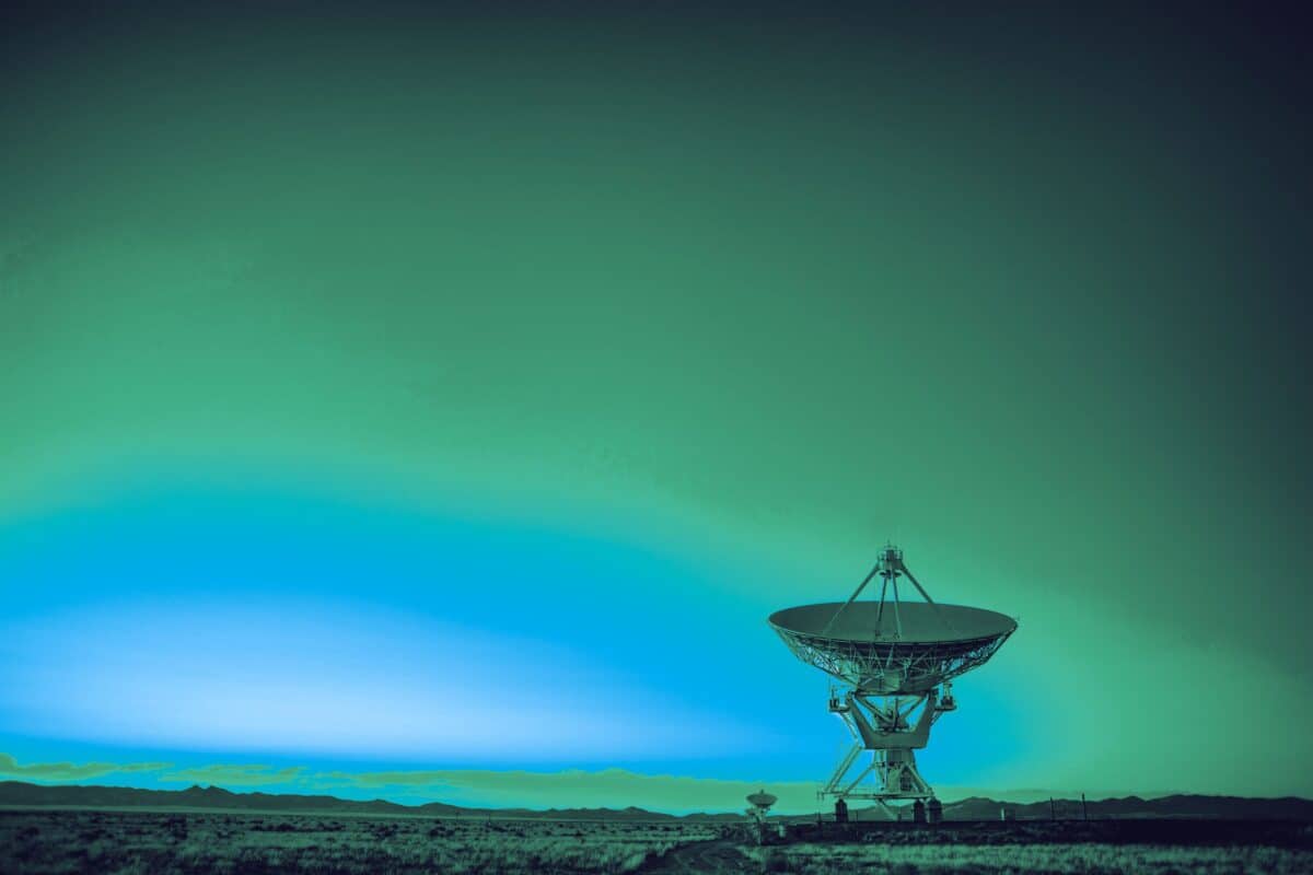Green atmospheric glow forming an abstract satellite industry background