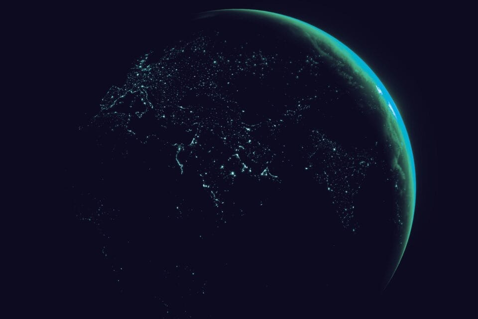 Dark Earth illuminated by city lights in a satellite communications scene
