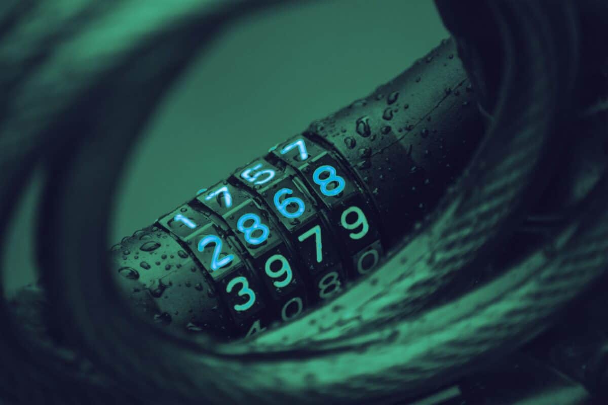 Hand using a keypad representing secure digital transactions and authentication
