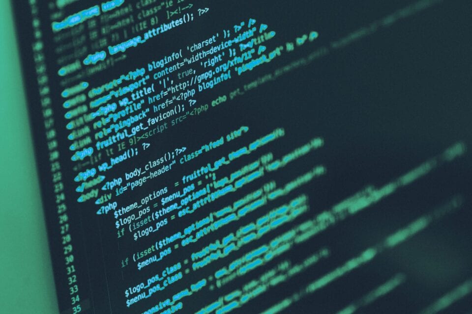 Computer code displayed on a screen in a cyber security setting