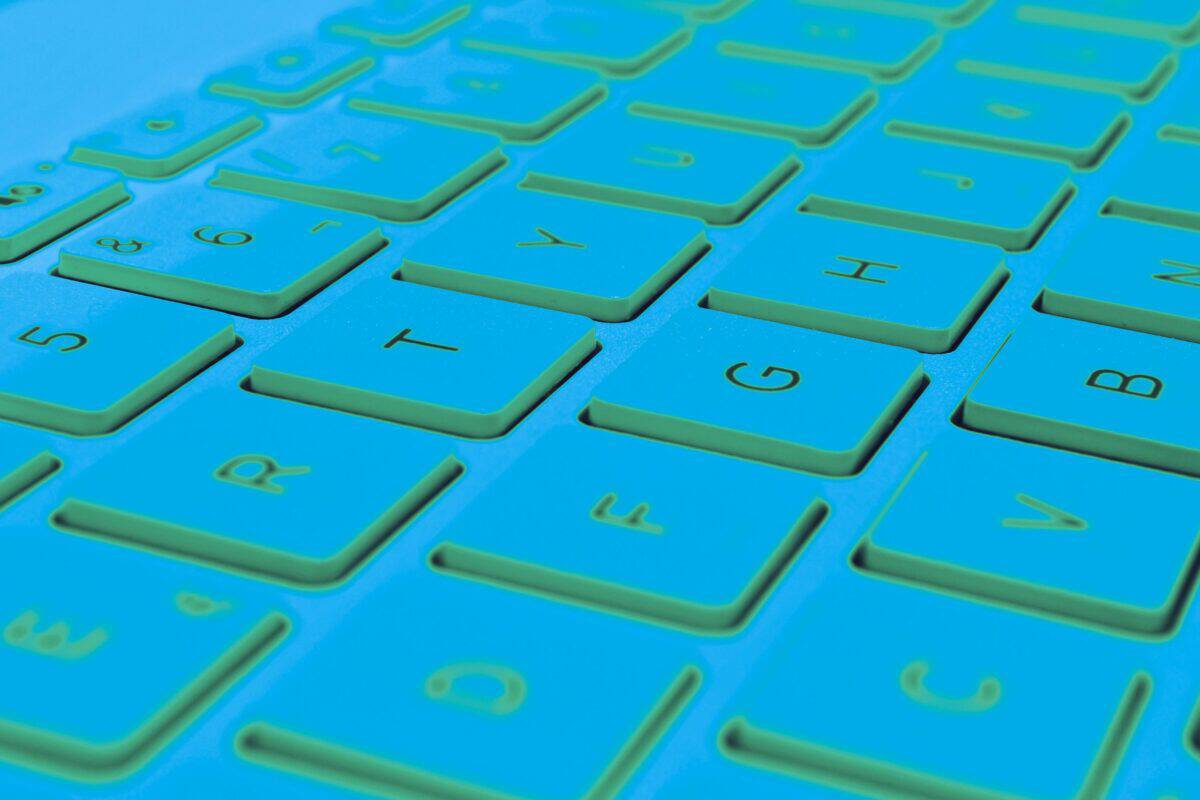 Close-up of keyboard keys illuminated in a cyber security setting