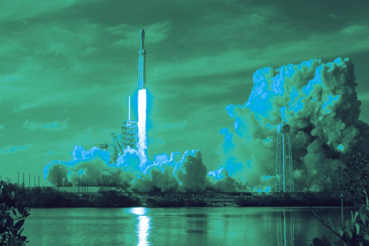 Rocket launching through clouds into the upper atmosphere