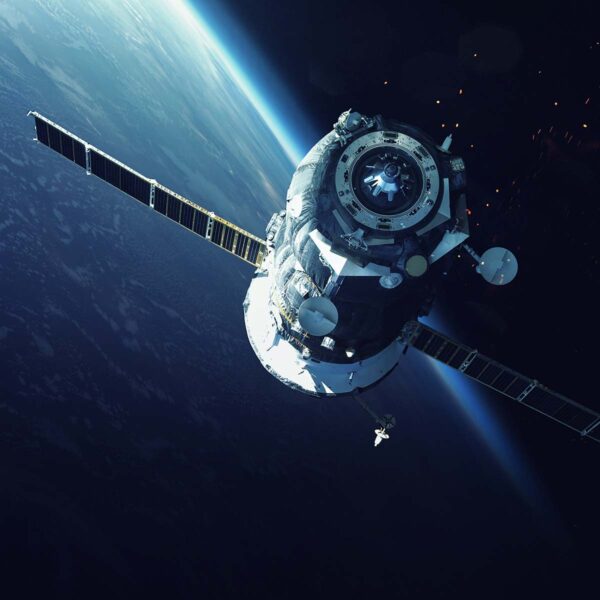 Satellite communications spacecraft orbiting above Earth