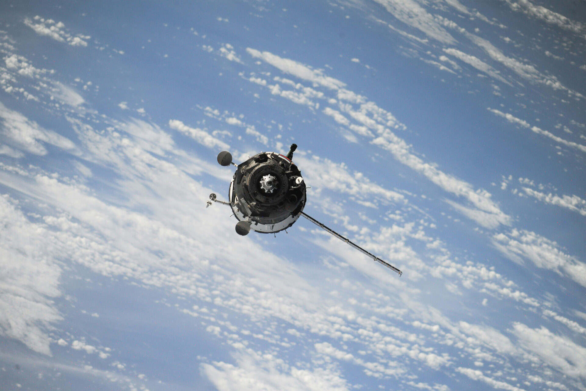 Satellite communications spacecraft orbiting above Earth