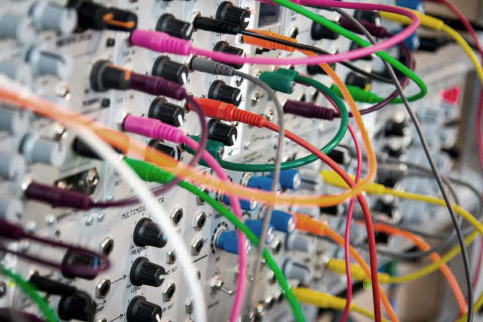 Colourful network cables connected to telecommunications equipment