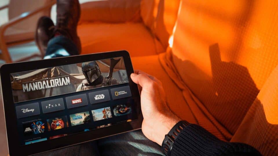 Person using a tablet to browse digital media content