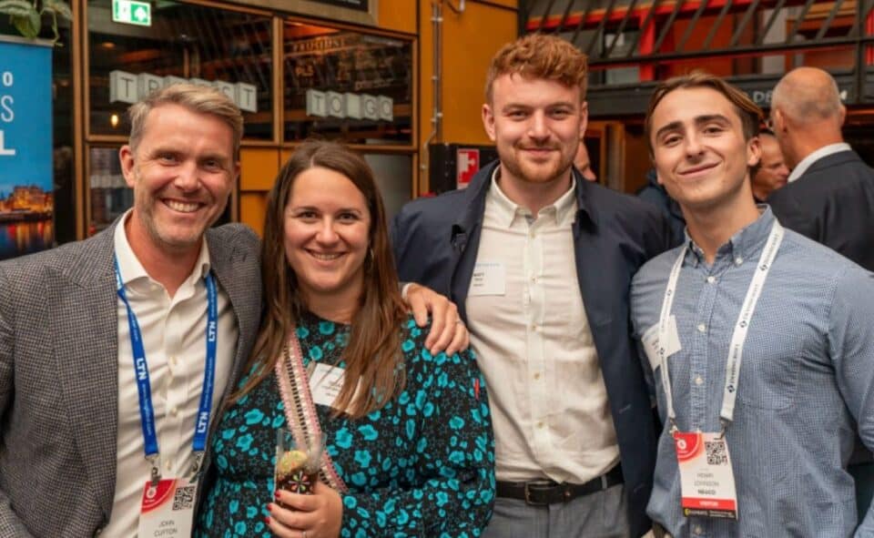 Attendees posing together at the IBC media industry event
