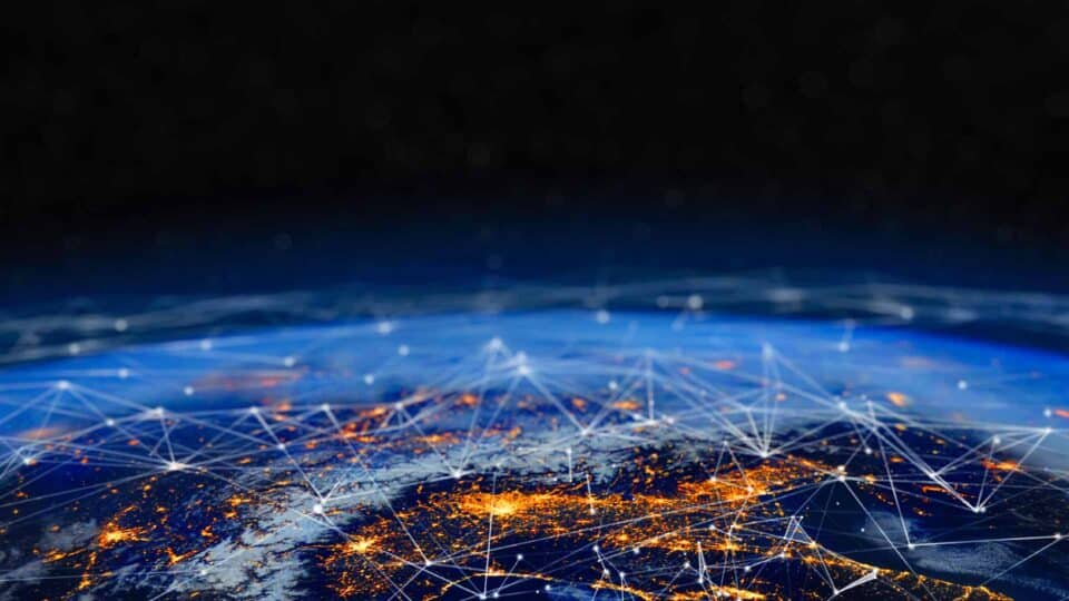Glowing network connections spreading across Earth from space