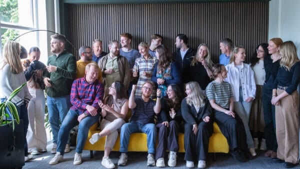 Neuco Group colleagues smiling together for a team portrait