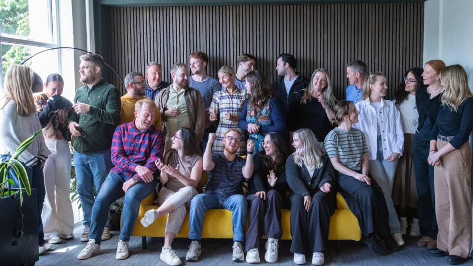 Neuco Group colleagues smiling together for a team portrait