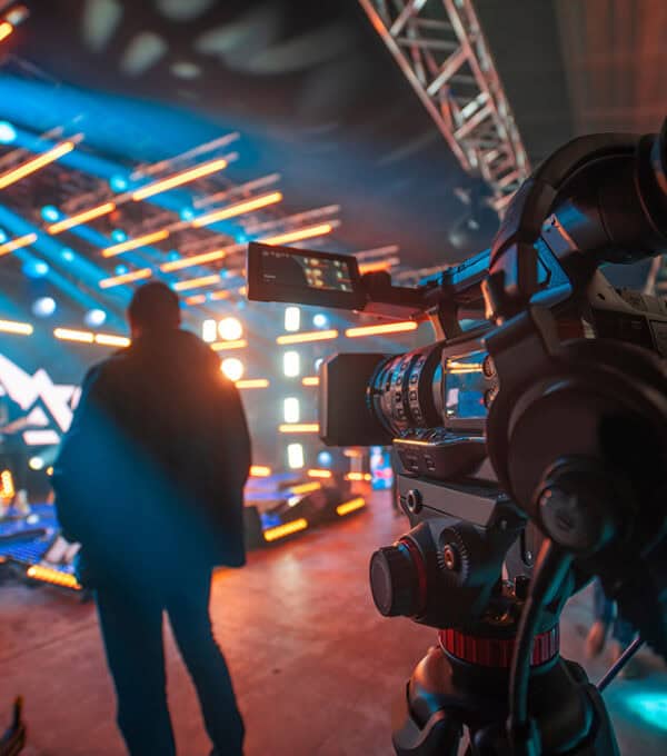 Broadcast professional working inside a modern media production studio