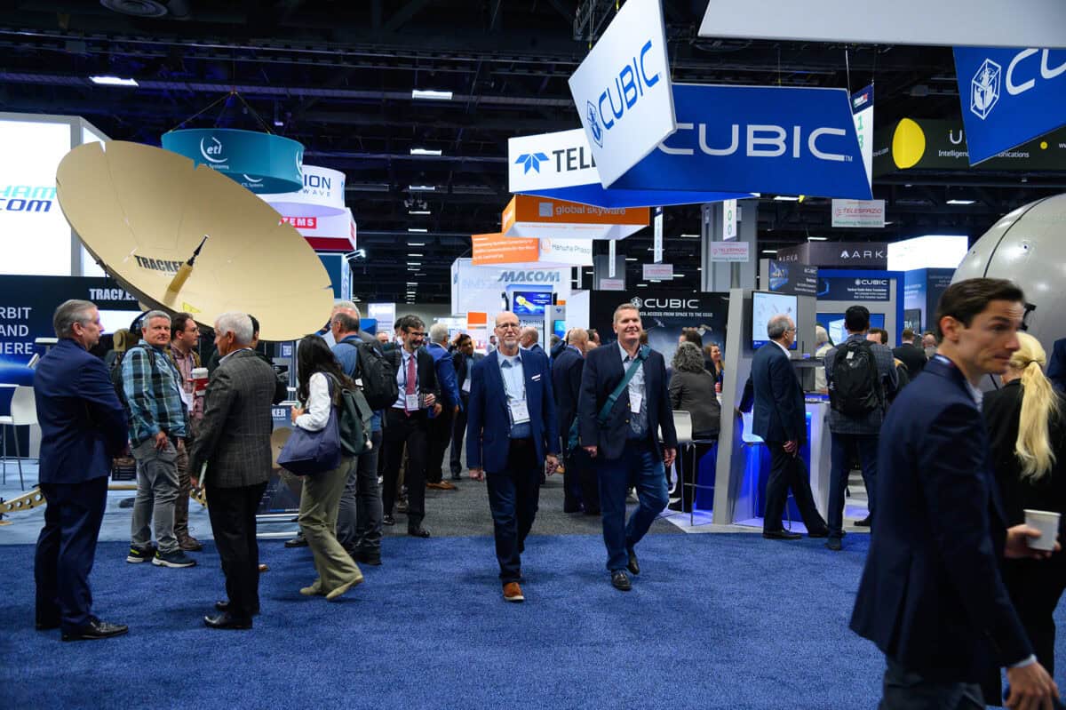Attendees gathering inside the Satellite Show exhibition hall