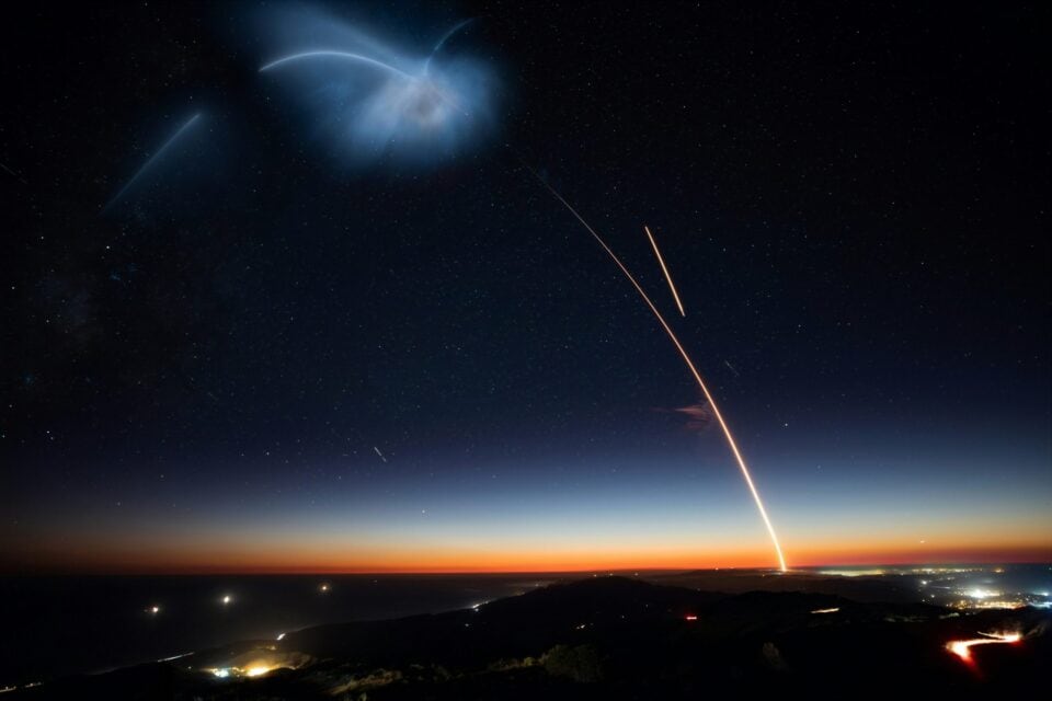 SpaceX rocket launching into the night sky above Earth