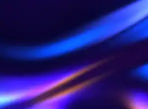 Flowing blue and purple light waves on a dark abstract background